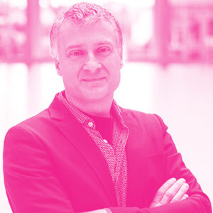 Andre Marziali's headshot with a hot pink filter.