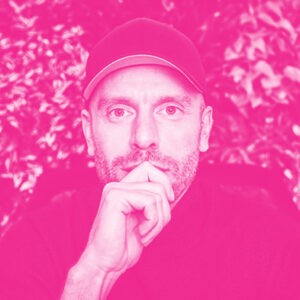 Constantin Schwaab's headshot with a hot pink filter.