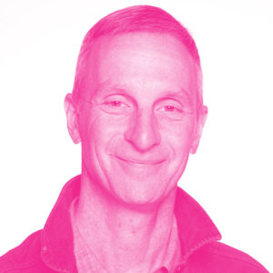 Dan Michelson's headshot with a hot pink filter.