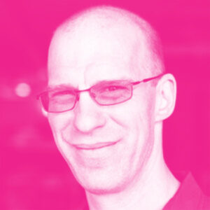 Eric Klein's headshot with a hot pink filter.