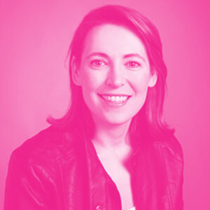 Gabrielle Munzer's headshot with a hot pink filter.
