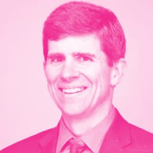 George Savage's headshot with a hot pink filter.