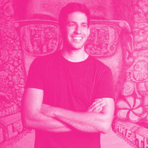 Gus Domel's headshot with a hot pink filter.