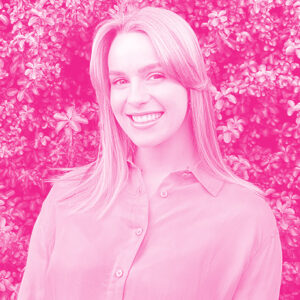 Ianthe Volbrecht's headshot with a hot pink filter.