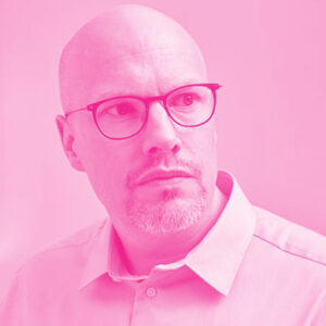 Ingo Kloeckner's headshot with a hot pink filter.