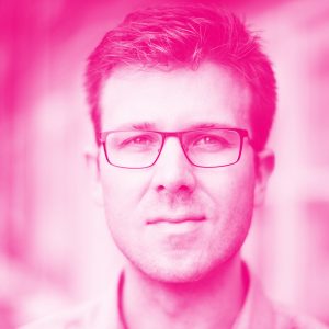 James Hardiman's headshot with a hot pink filter.