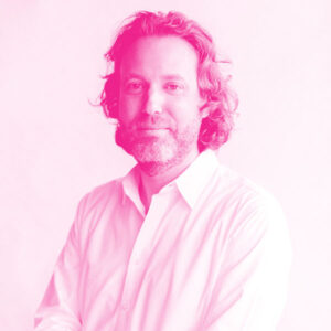 Jeff Kaplan's headshot with a hot pink filter.