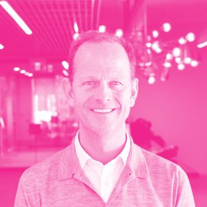 Joel Finlayson's headshot with a hot pink filter.