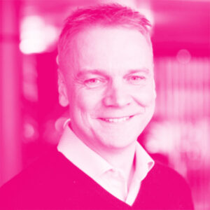 Marek Kiisa's headshot with a hot pink filter.