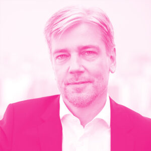 Matthias Wernicke's headshot with a hot pink filter.