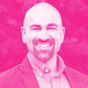 Nick Shah's headshot with a hot pink filter.