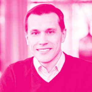 Rainer Sternfe's headshot with a hot pink filter.