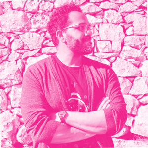 Ronald Ashri's headshot with a hot pink filter.