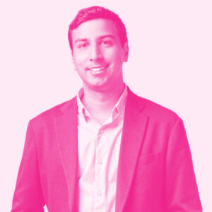 Sanjay Zimmerman's headshot with a hot pink filter.