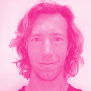 Sean Glass' headshot with a hot pink filter.