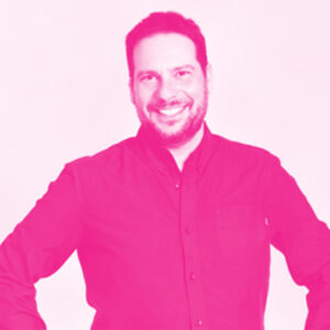 Sylvain Carle's headshot with a hot pink filter.