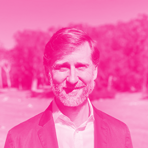 Doug Foster's headshot with a hot pink filter.