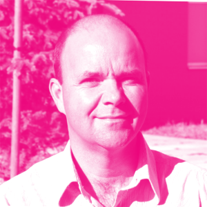 Michael Ball's headshot with a hot pink filter.