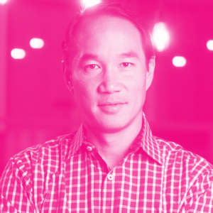 Michael Yang's headshot with a hot pink filter.