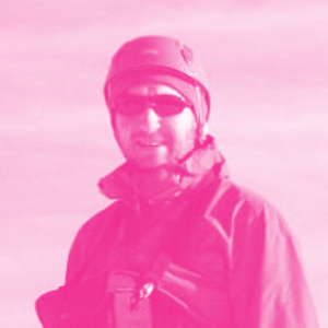 Val Rubinchik's headshot with a hot pink filter.