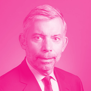 William (Bill) Schnoor's headshot with a hot pink filter.